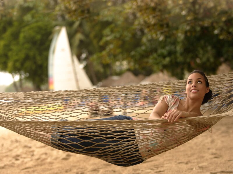 Woman relaxing in a hammock