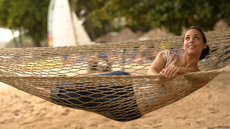 Woman relaxing in a hammock