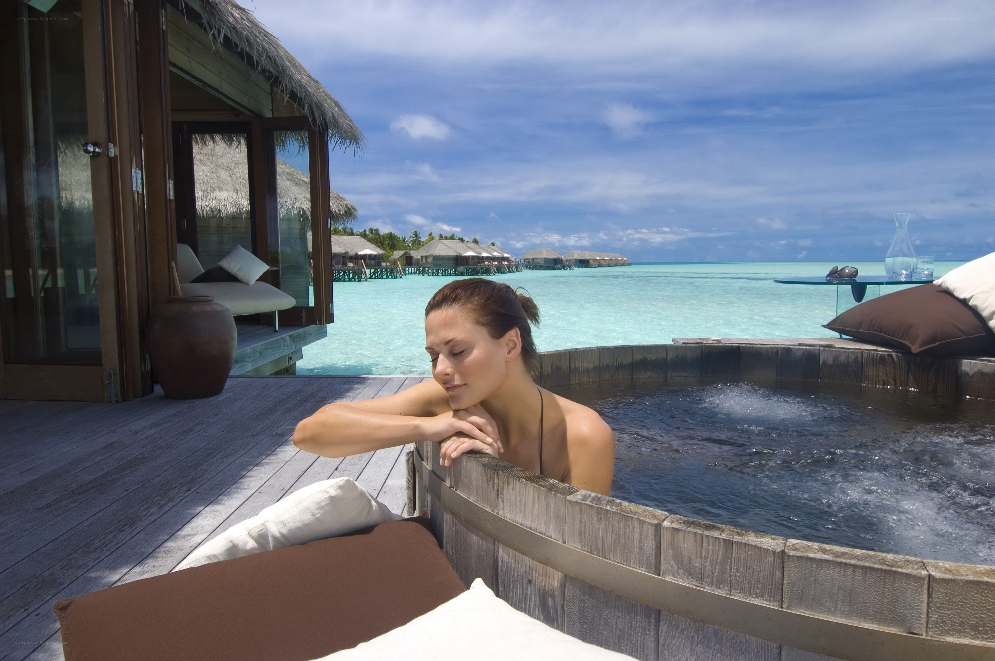 Woman relaxing in a hot tub