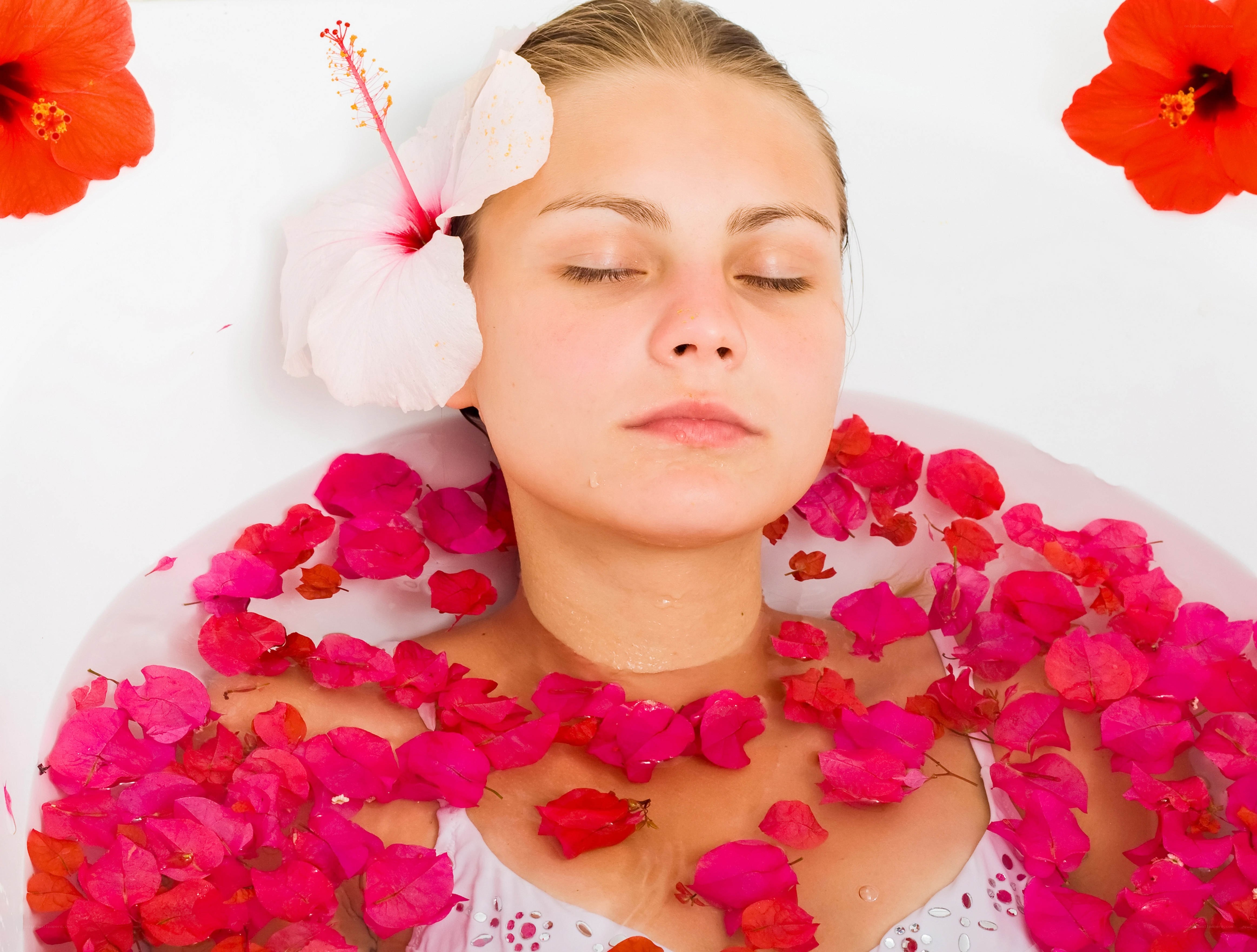 woman relaxing in flower bath