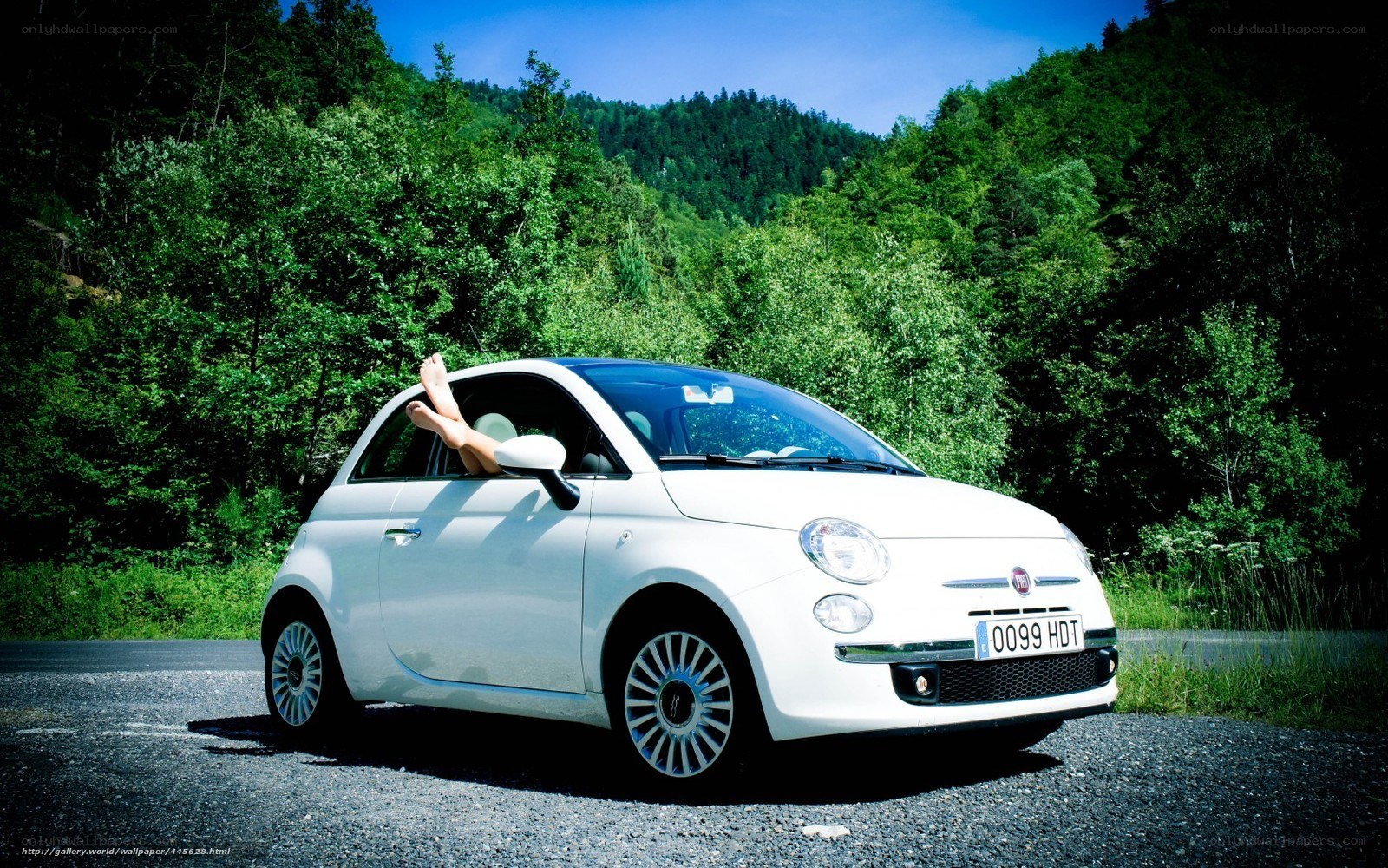 Woman relaxing in white car