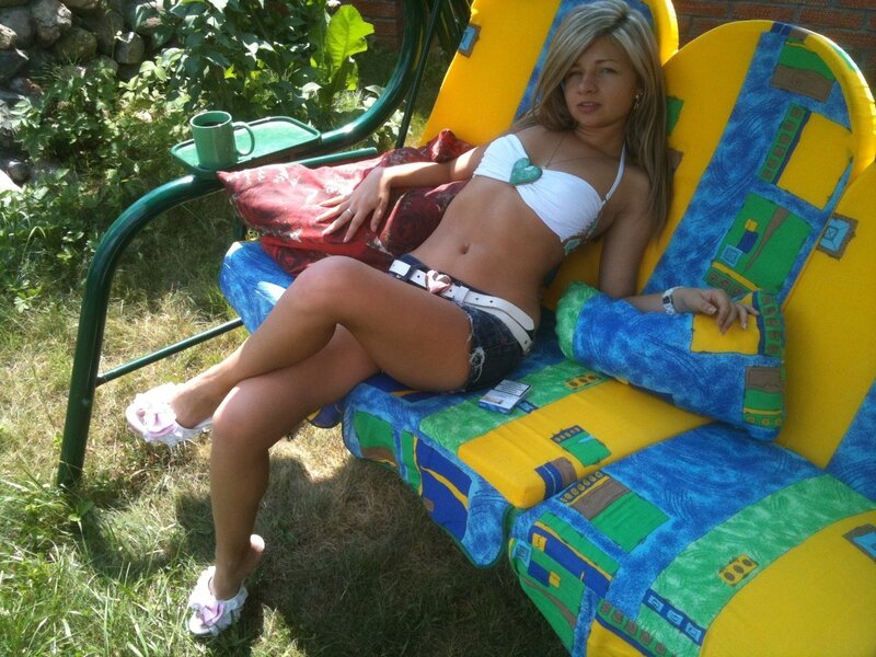 Woman relaxing on a colorful bench