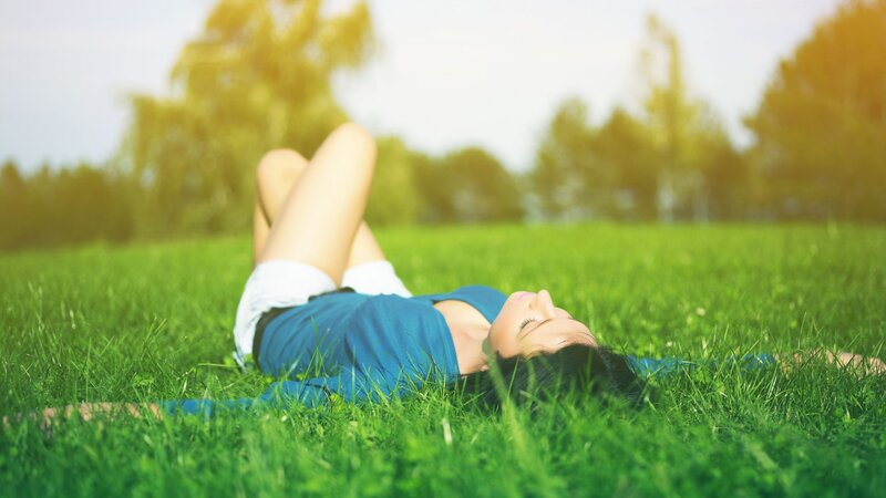 Woman relaxing on grass