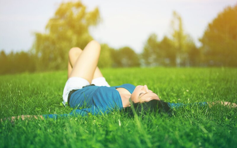 Woman relaxing on grass