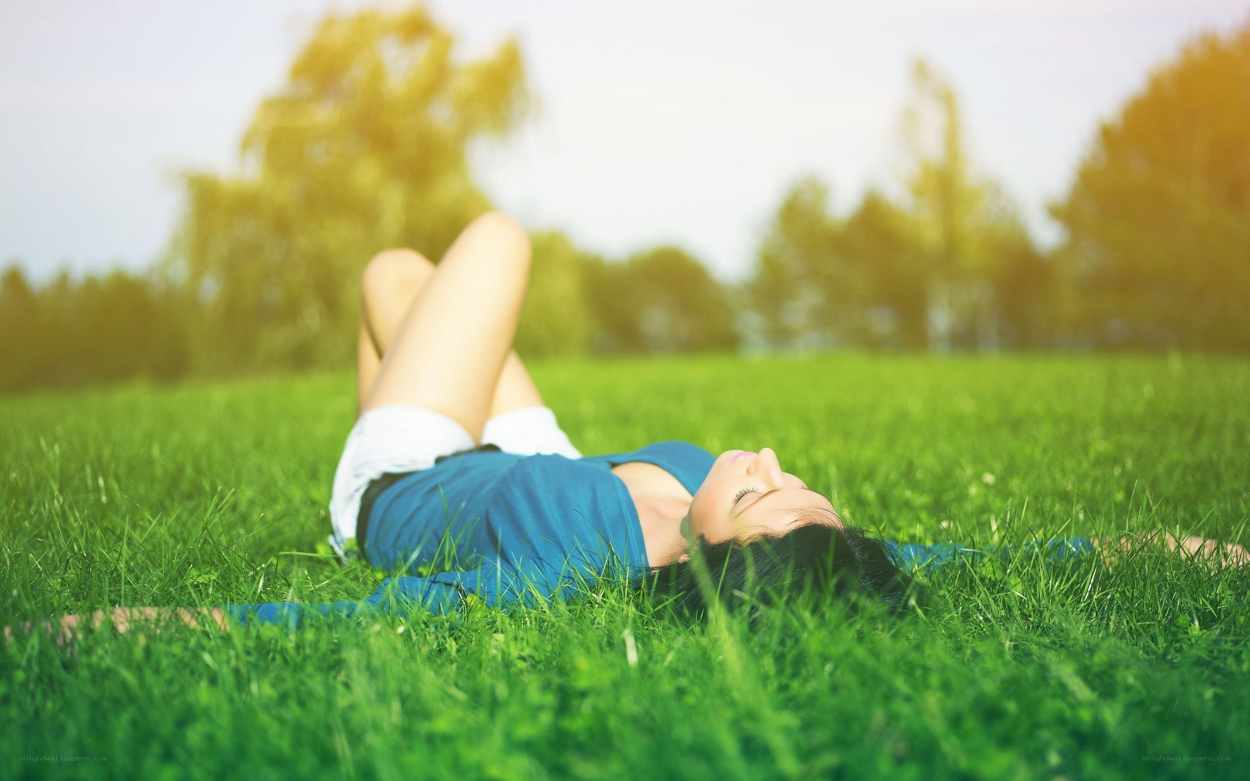 Woman relaxing on grass