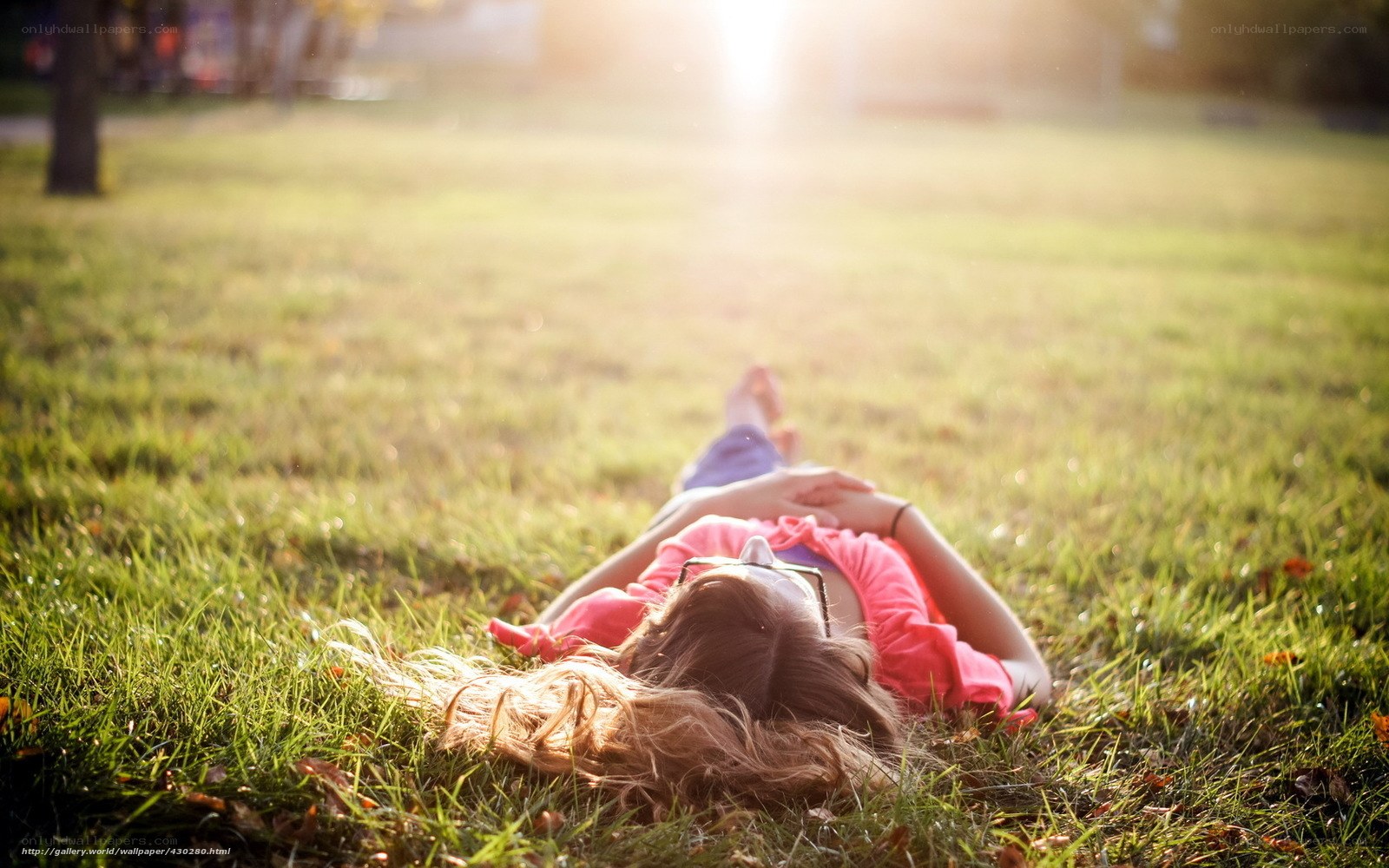 Woman relaxing on grass