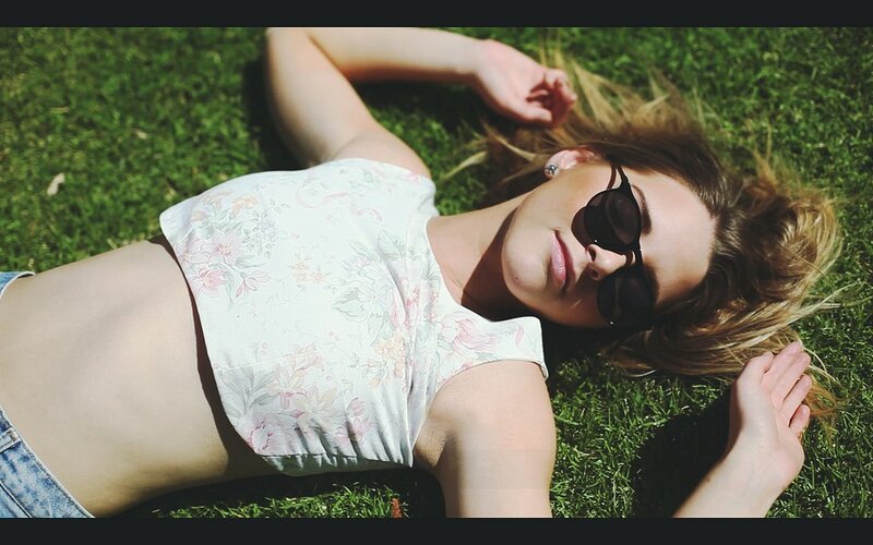woman relaxing on grass