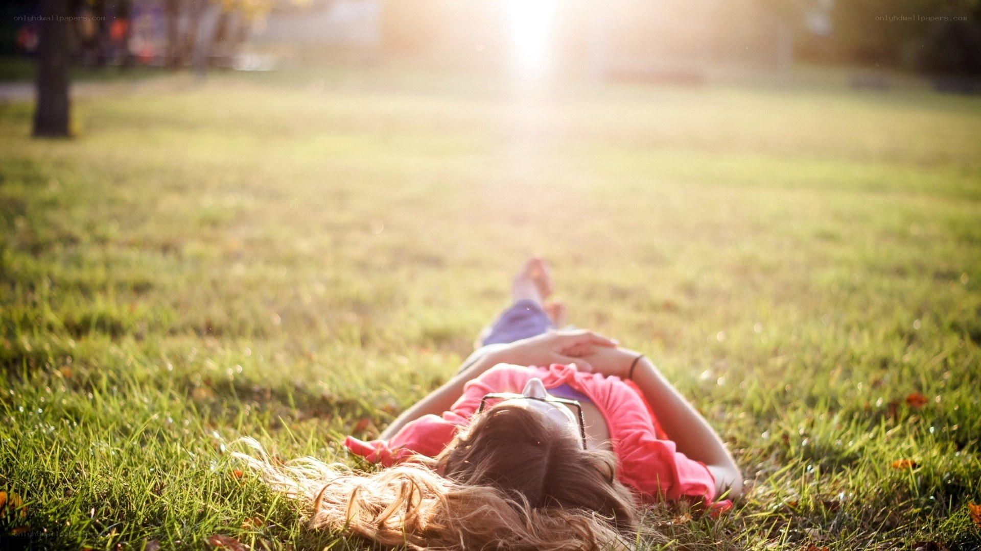 Woman relaxing on grass