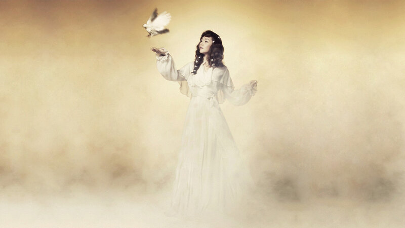 woman releasing a dove