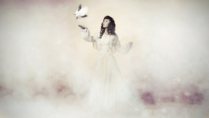 woman releasing a dove