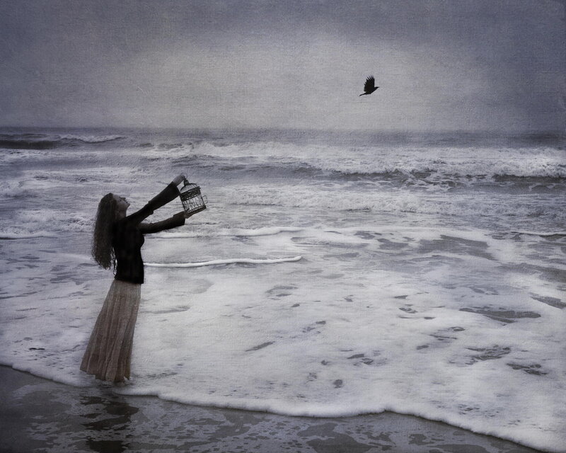 Woman Releasing Bird — Gray