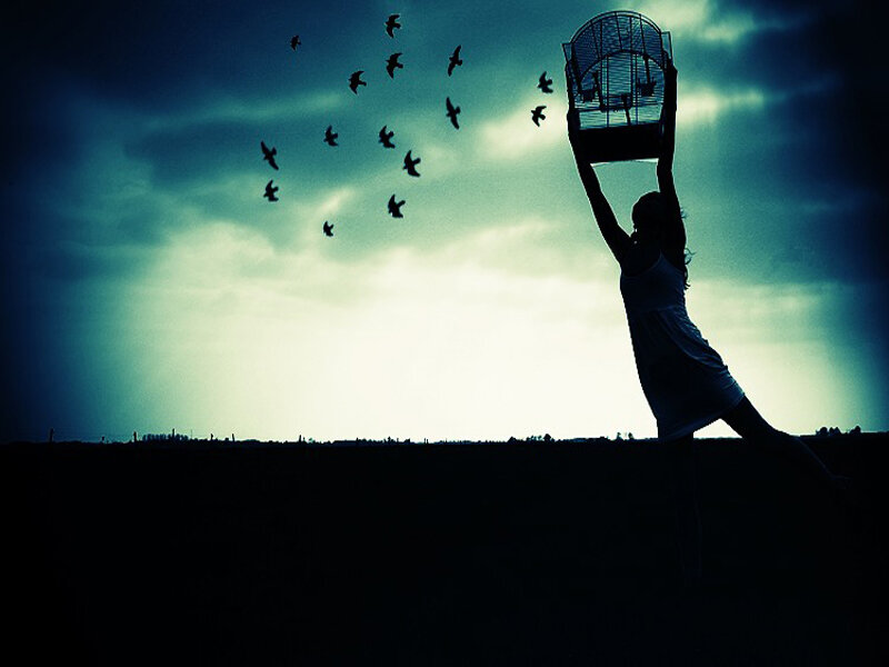 Woman Releasing Birds