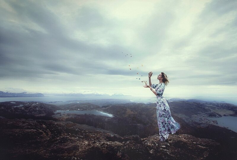 Woman Releasing Butterflies — Gray