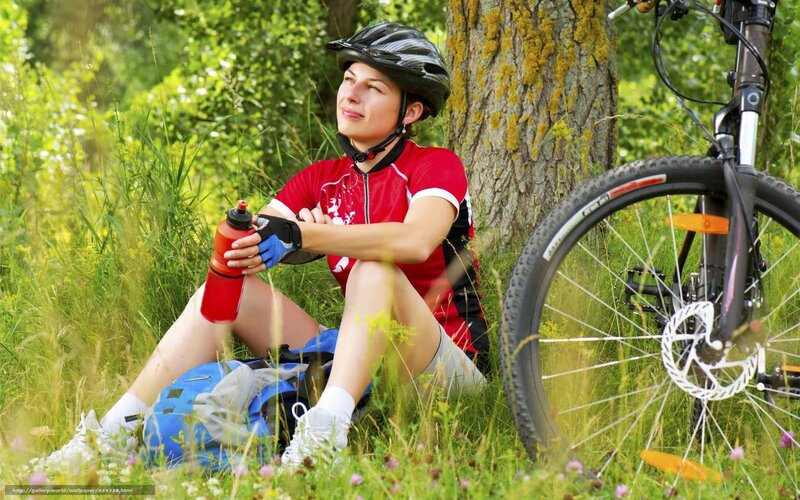 Woman resting after bike ride