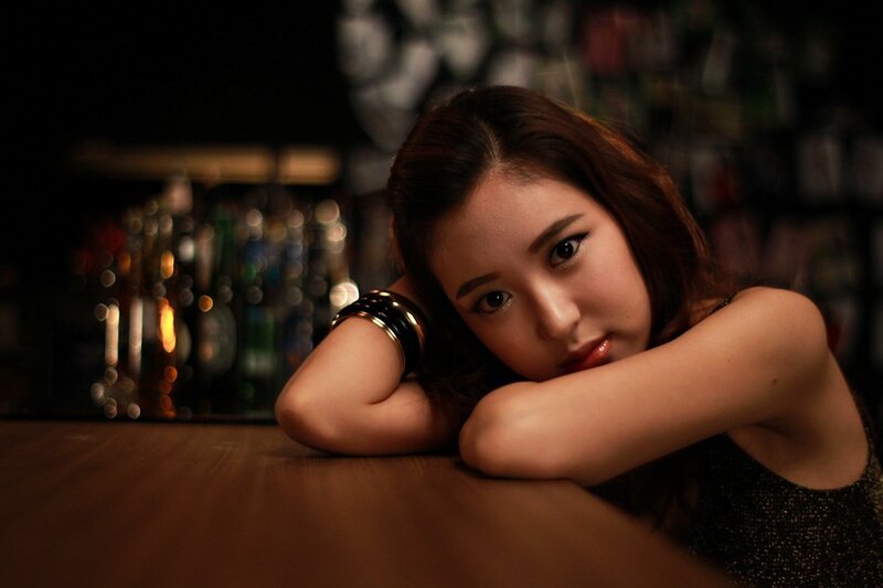 woman resting at a bar