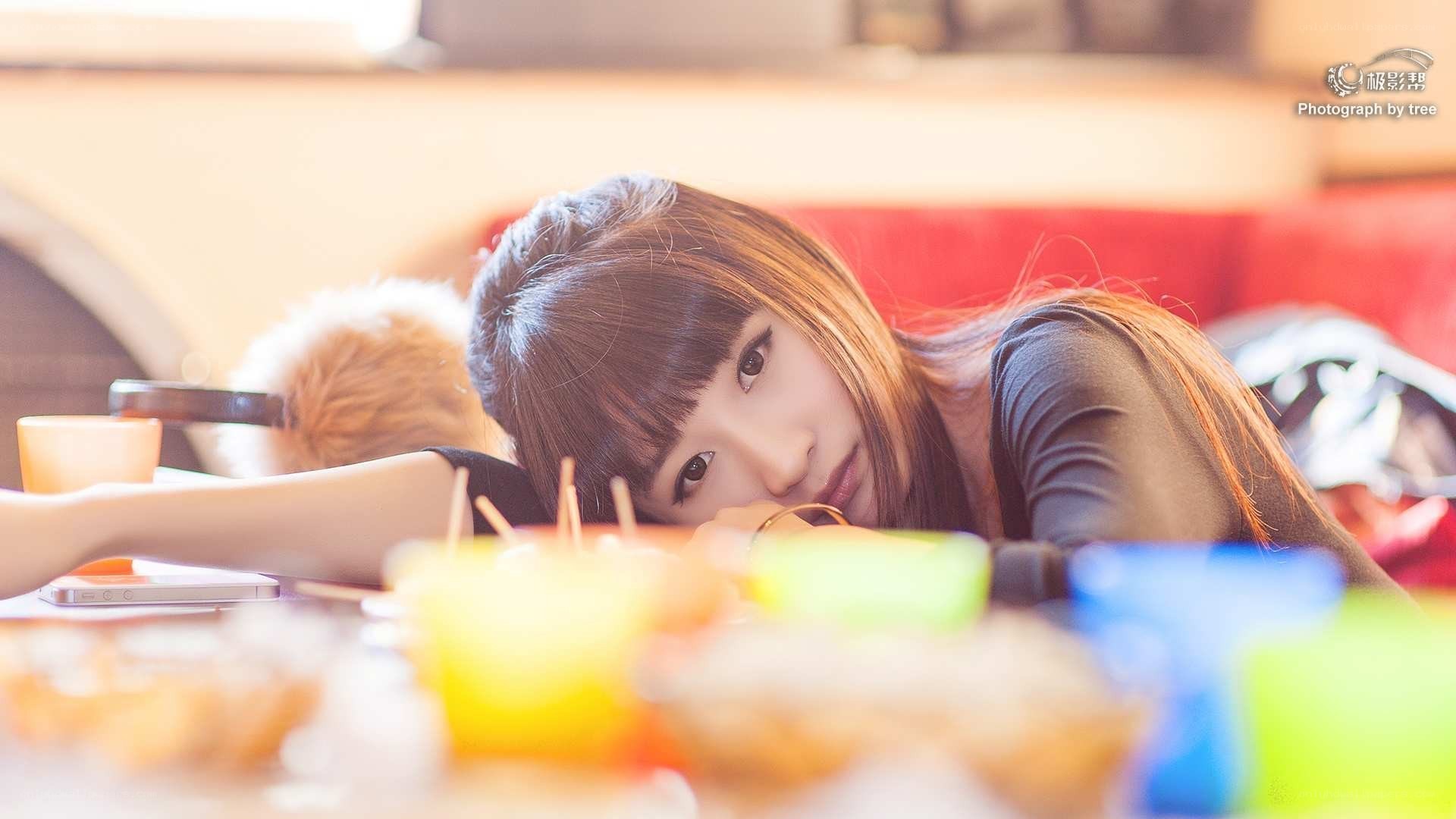 woman resting at a table