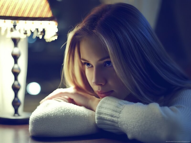 woman resting by lamp