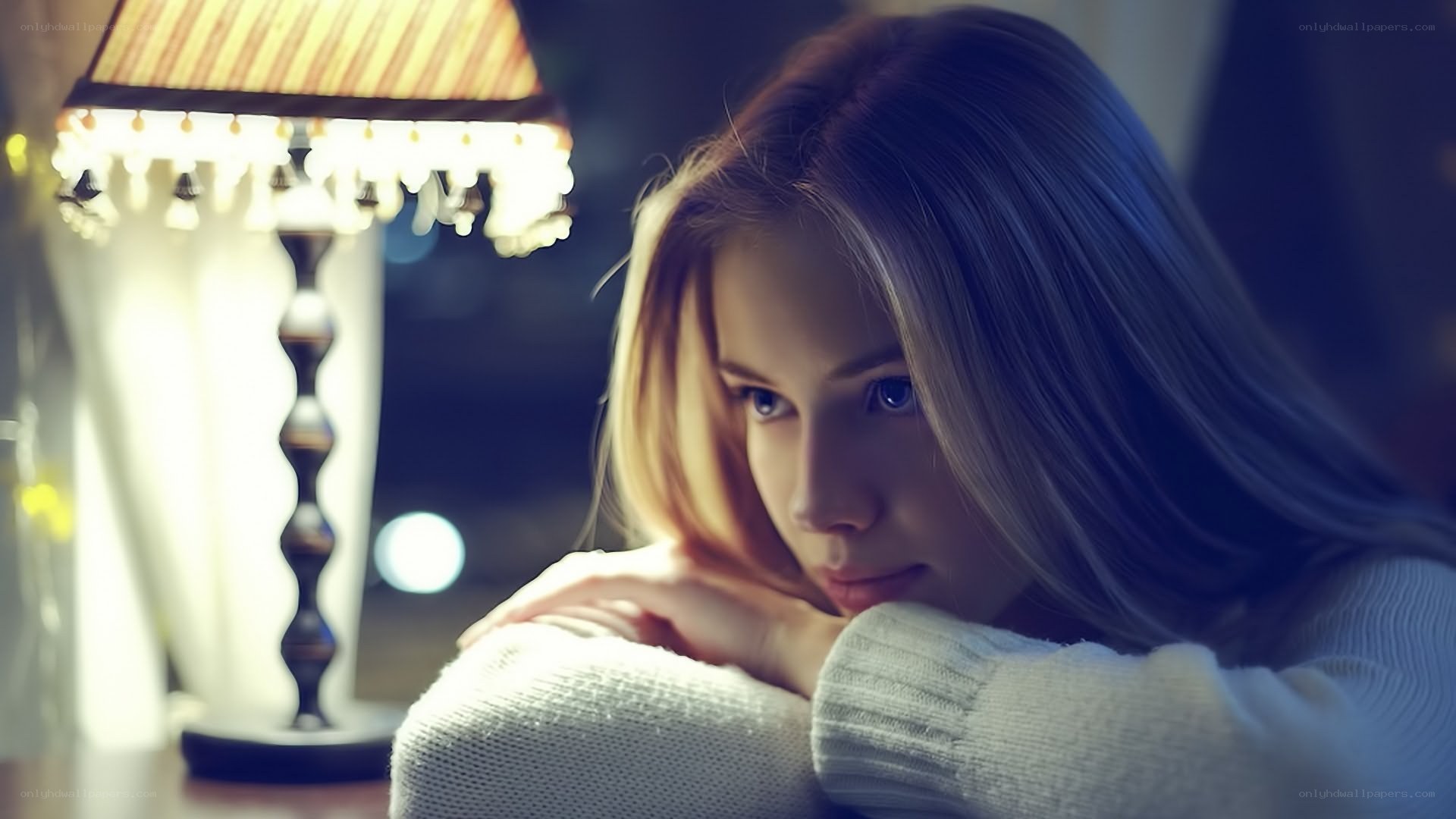 woman resting by lamp