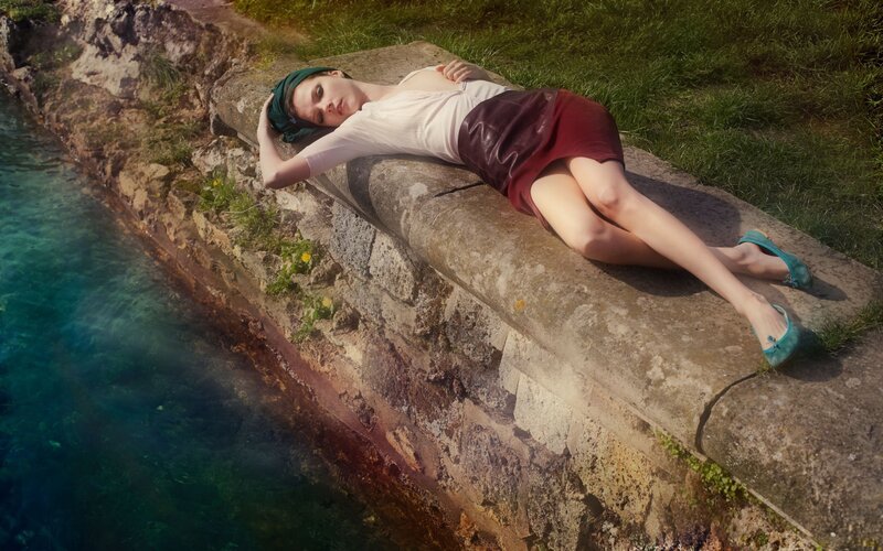 Woman resting by the water