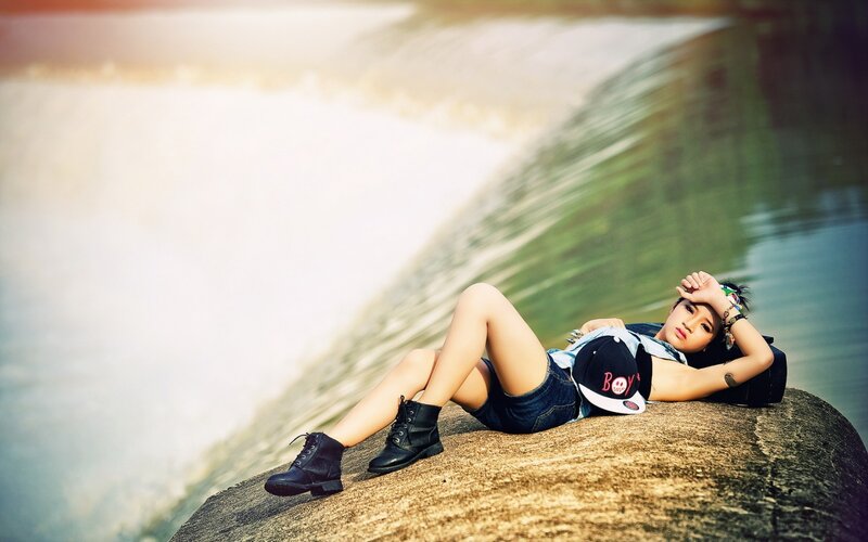 woman resting by the water