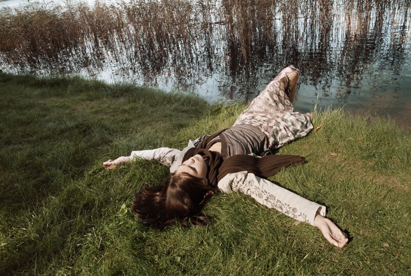 Woman resting by the water