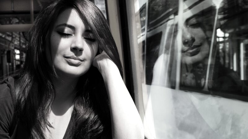 woman resting by train window