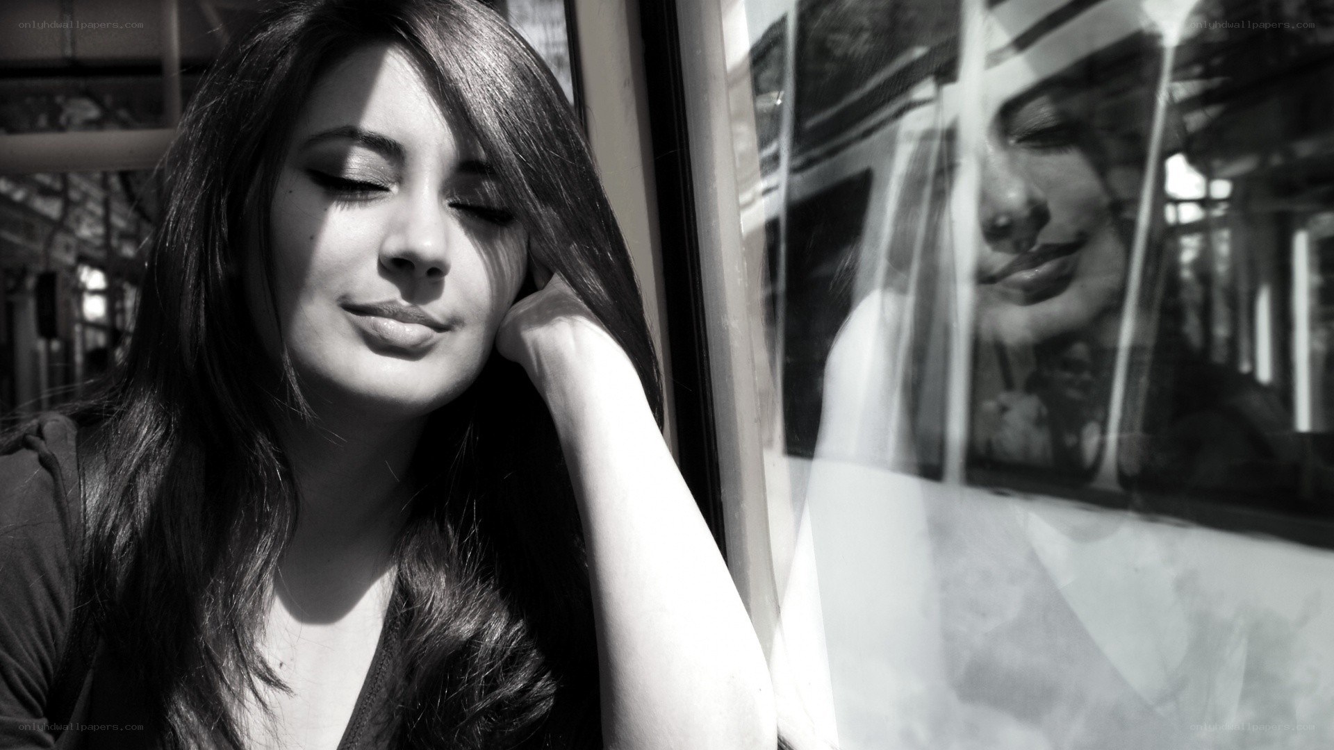 woman resting by train window