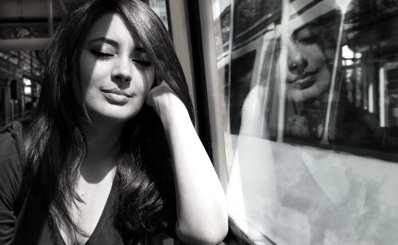 woman resting by train window