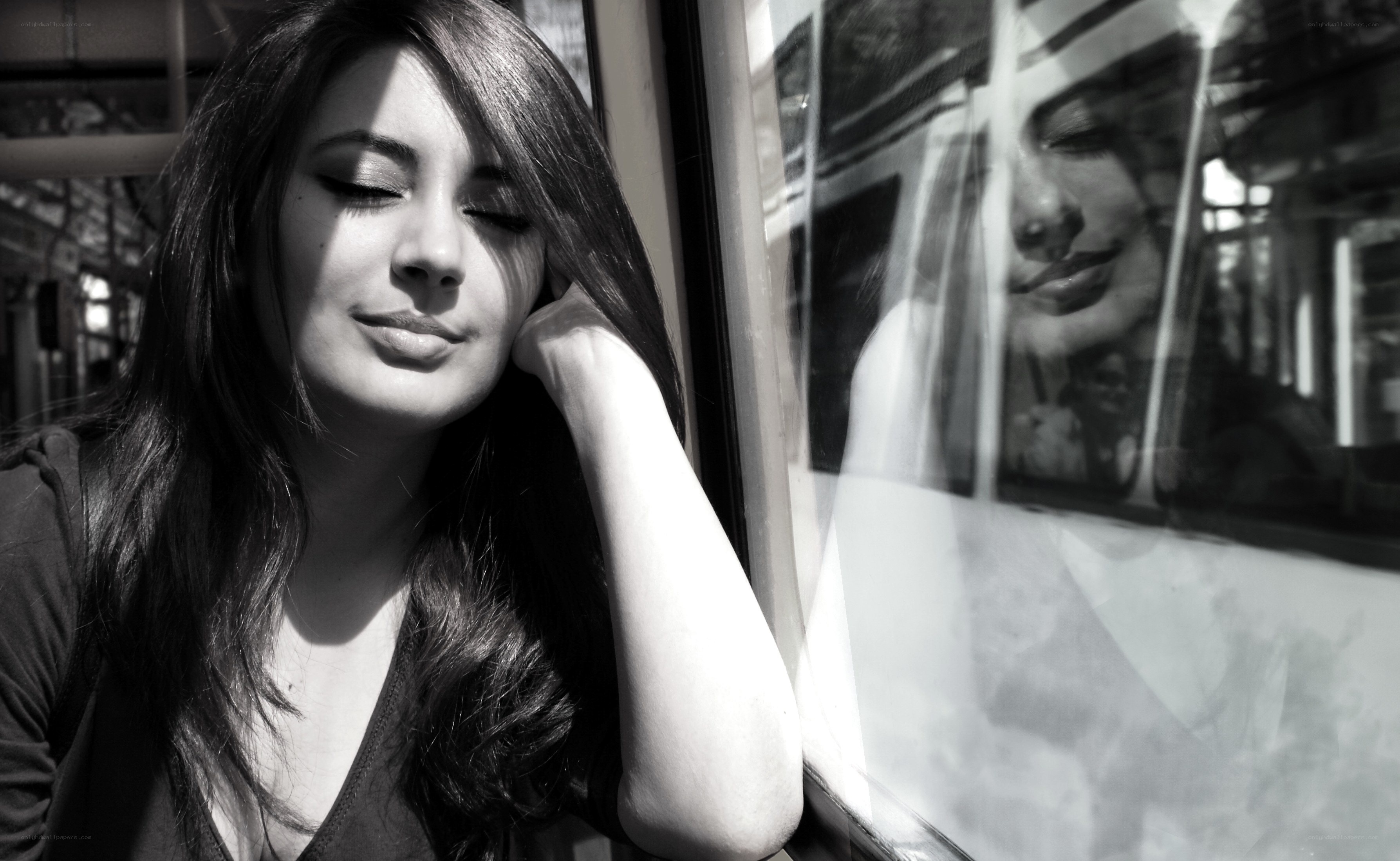 woman resting by train window