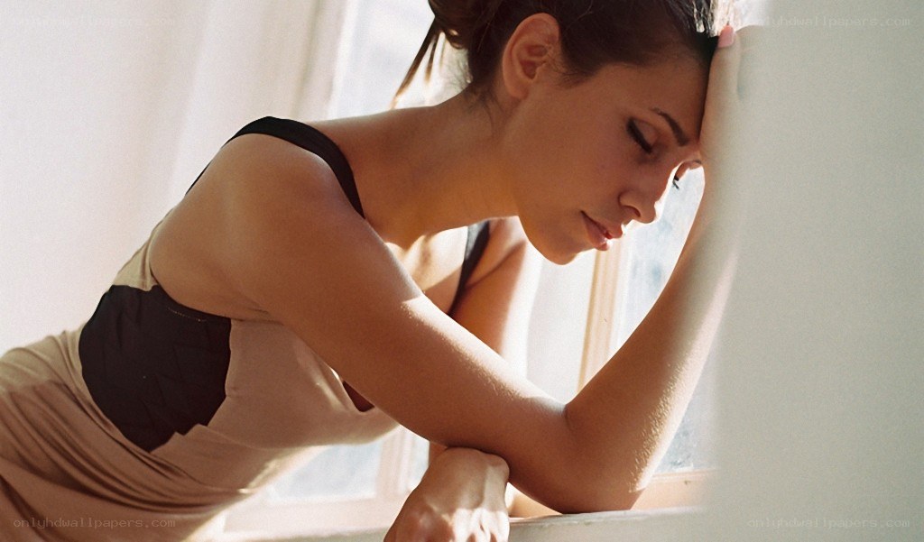 woman resting by window