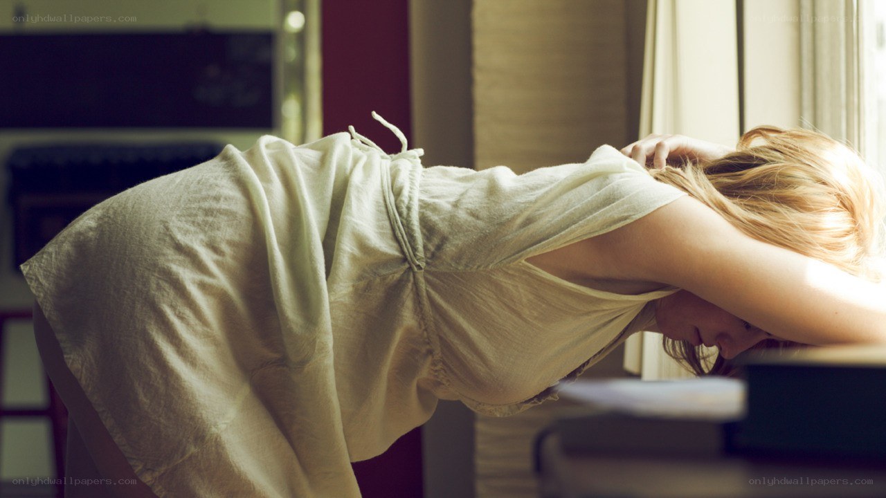 woman resting by window