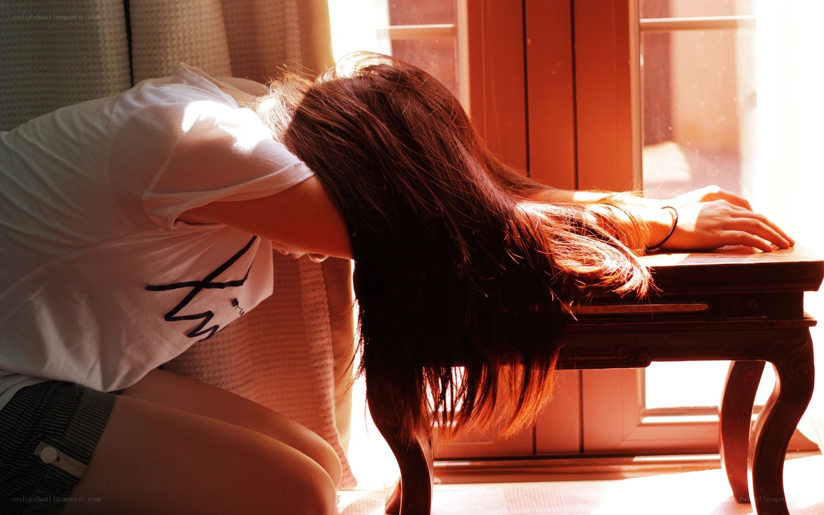 woman resting by window
