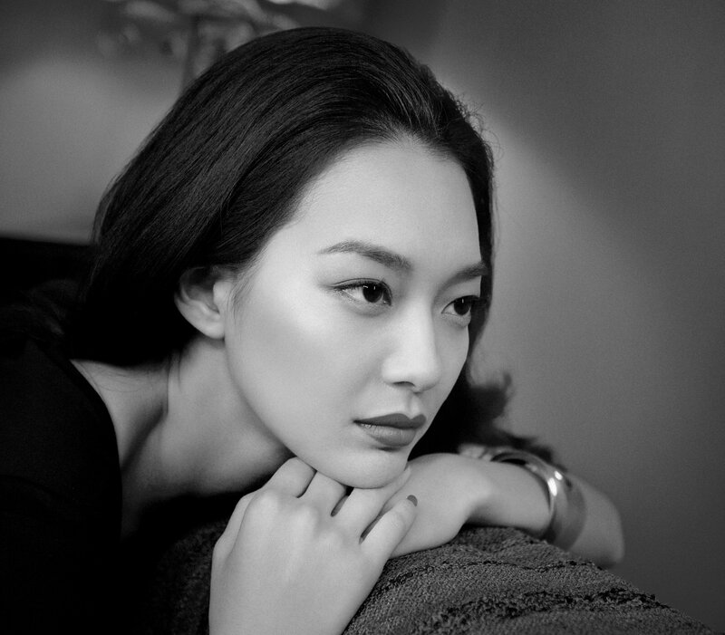 Woman Resting Chin on Hand