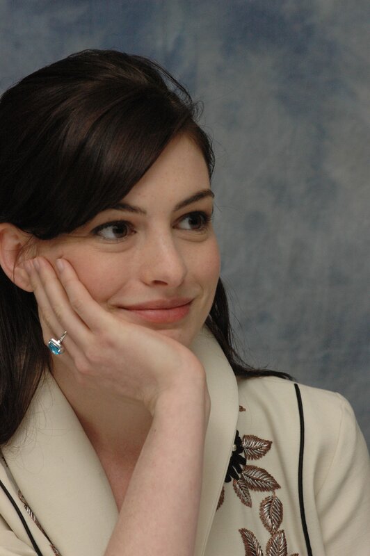 woman resting hand on cheek