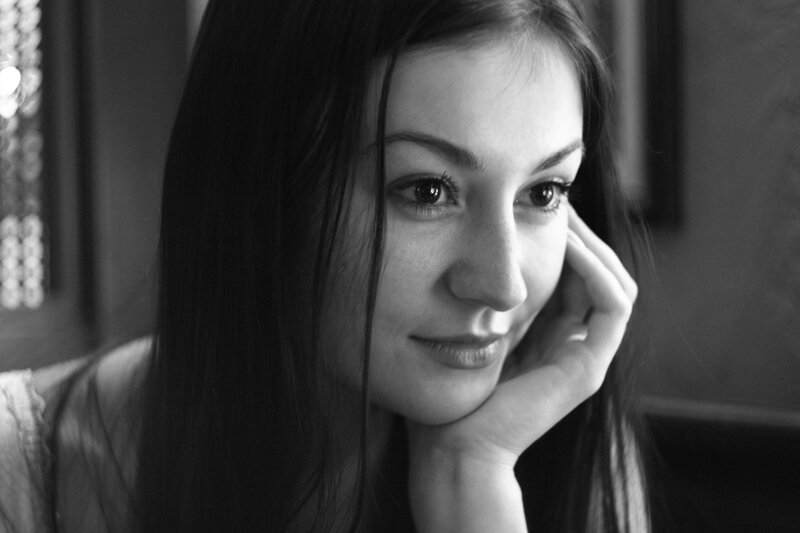 woman resting her chin on hand