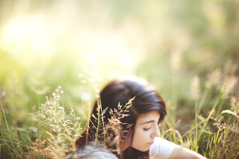 woman resting in a field