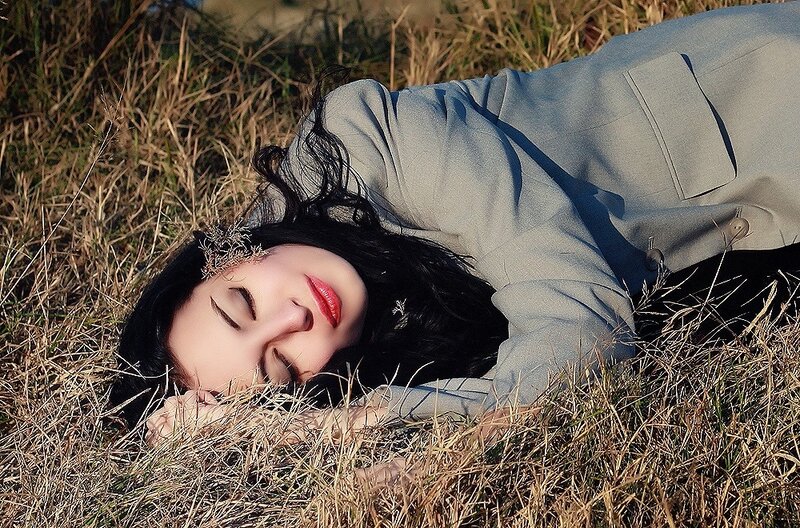 Woman resting in a field