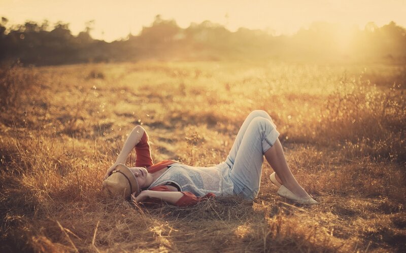 Woman resting in a field