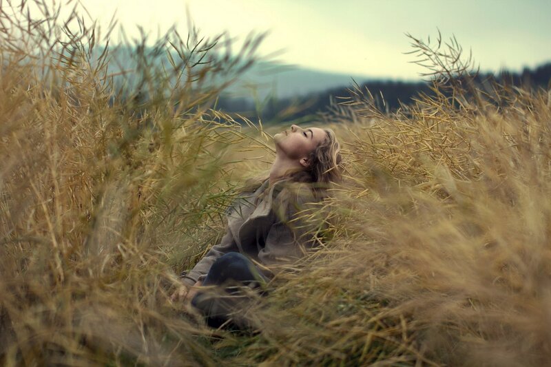 woman resting in a field