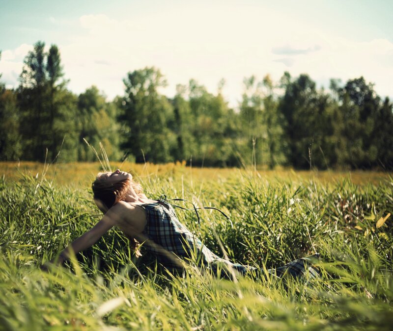 woman resting in a field