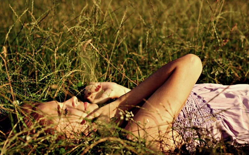woman resting in a field