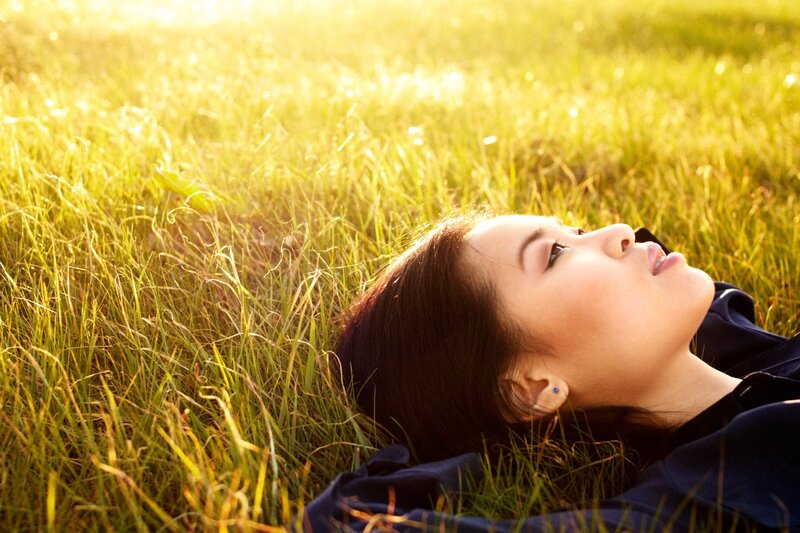 woman resting in a field