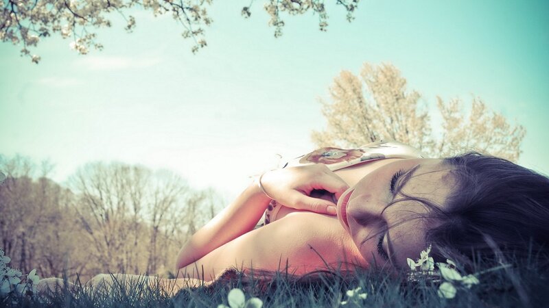 Woman resting in a field