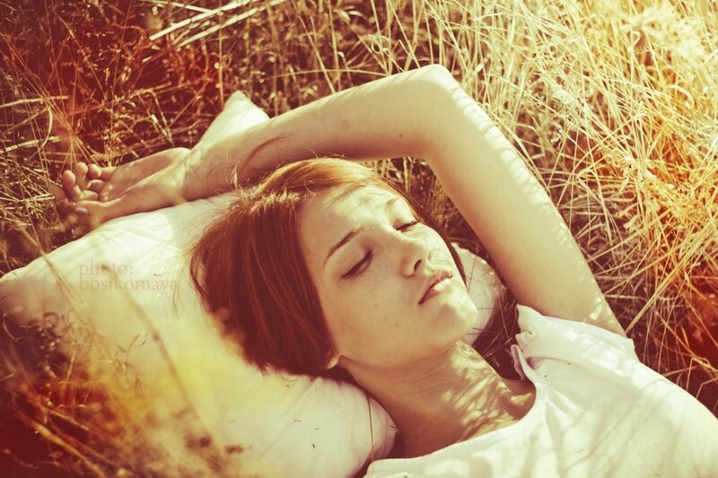 woman resting in a field
