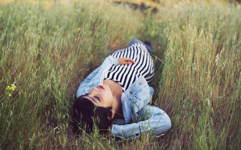 woman resting in a field