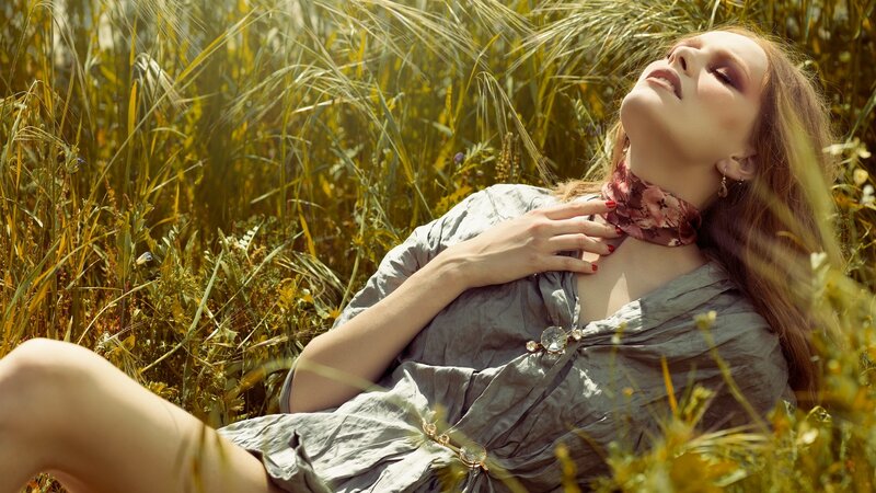 woman resting in a field
