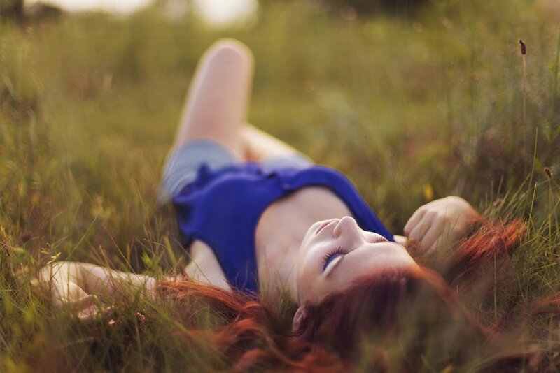 woman resting in a field