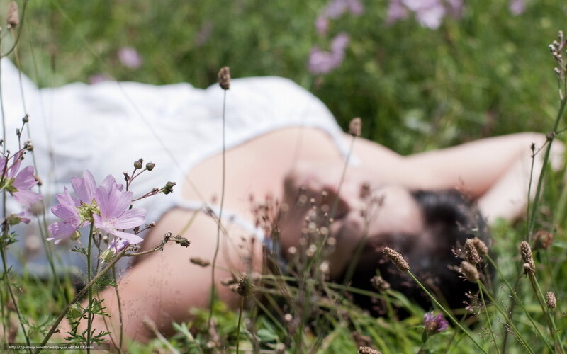 Woman resting in a field