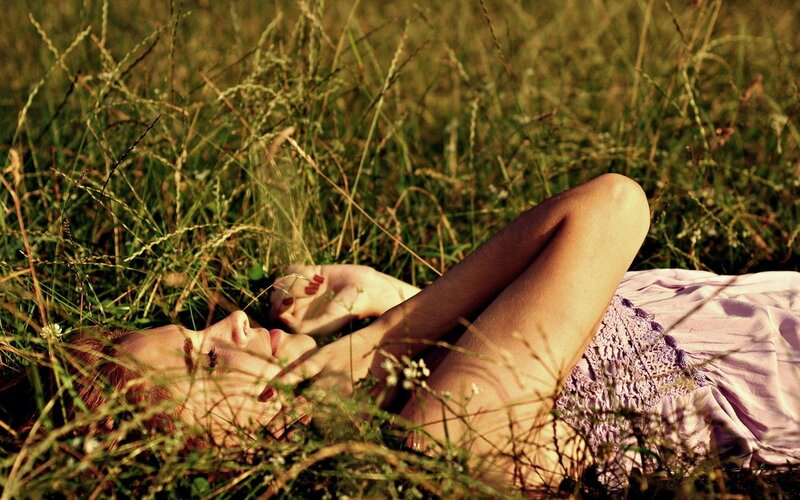 Woman resting in a field