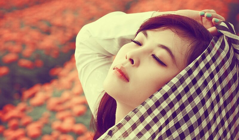 woman resting in a flower field